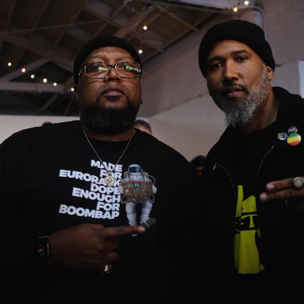 Two people at a Modbap table