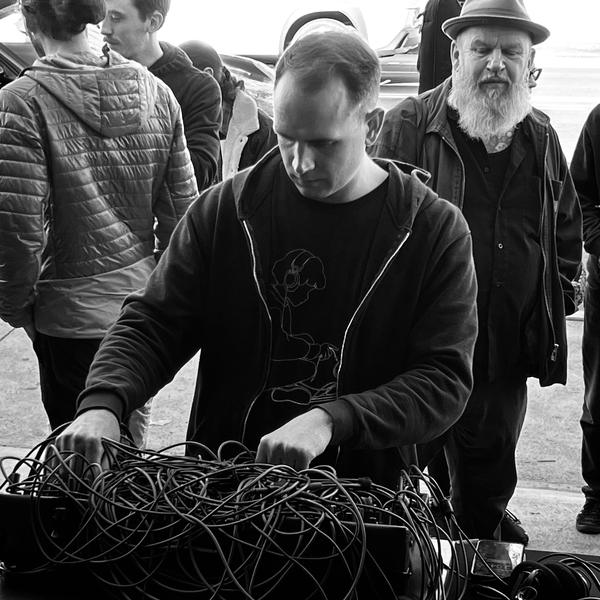 Hands working a table of patch cables